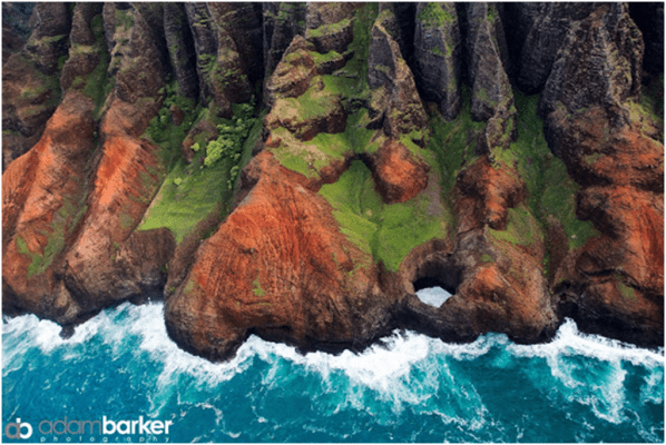 An aerial view of a rocky cliff in hawaii.