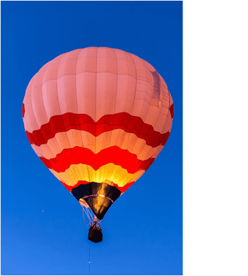 A hot air balloon flying in the sky.