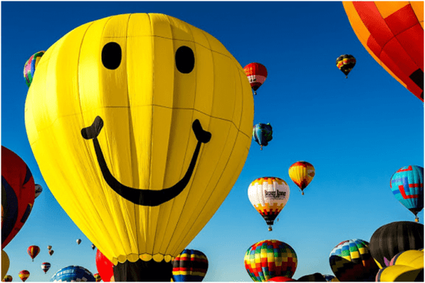 A smiley face on a hot air balloon.