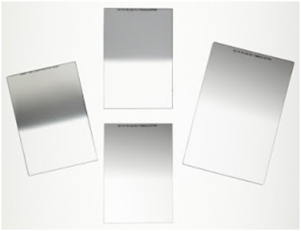 Four silver and white filters on a white background.