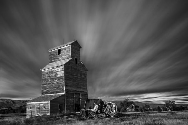 Black and White Photo of a Barn and cloudy sky