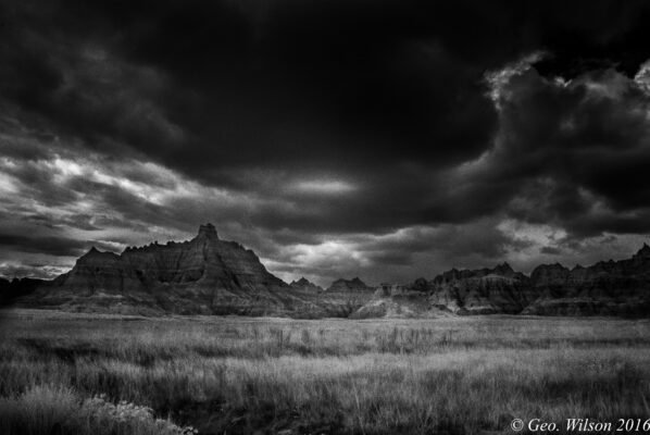 Black and white photo of a stormy landscape.