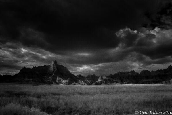 Black and white photo of a mountain range.